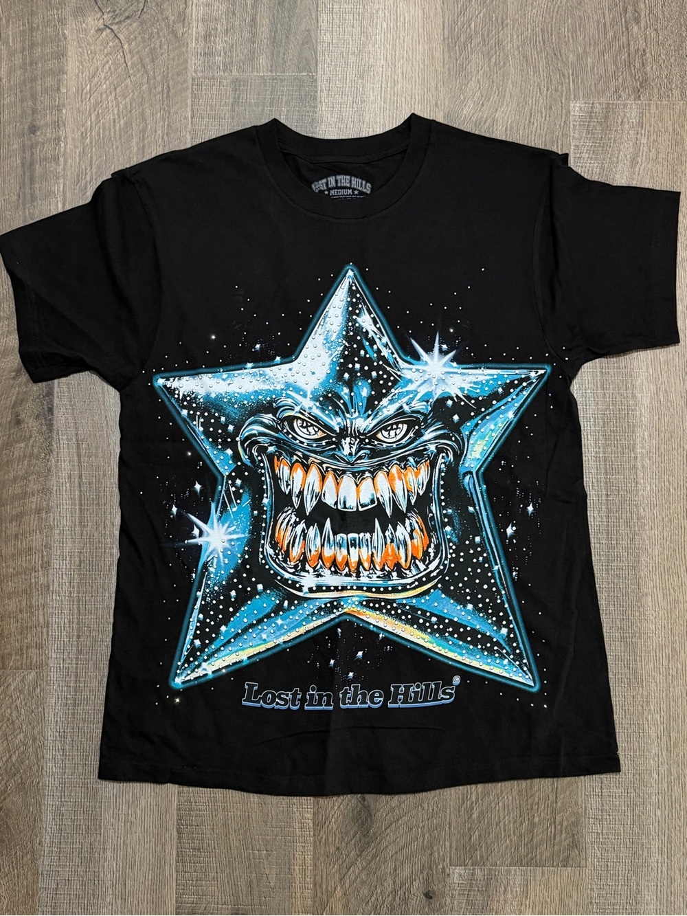 Lost in the Hills Black Graphic Tee with Blue Star Monster
